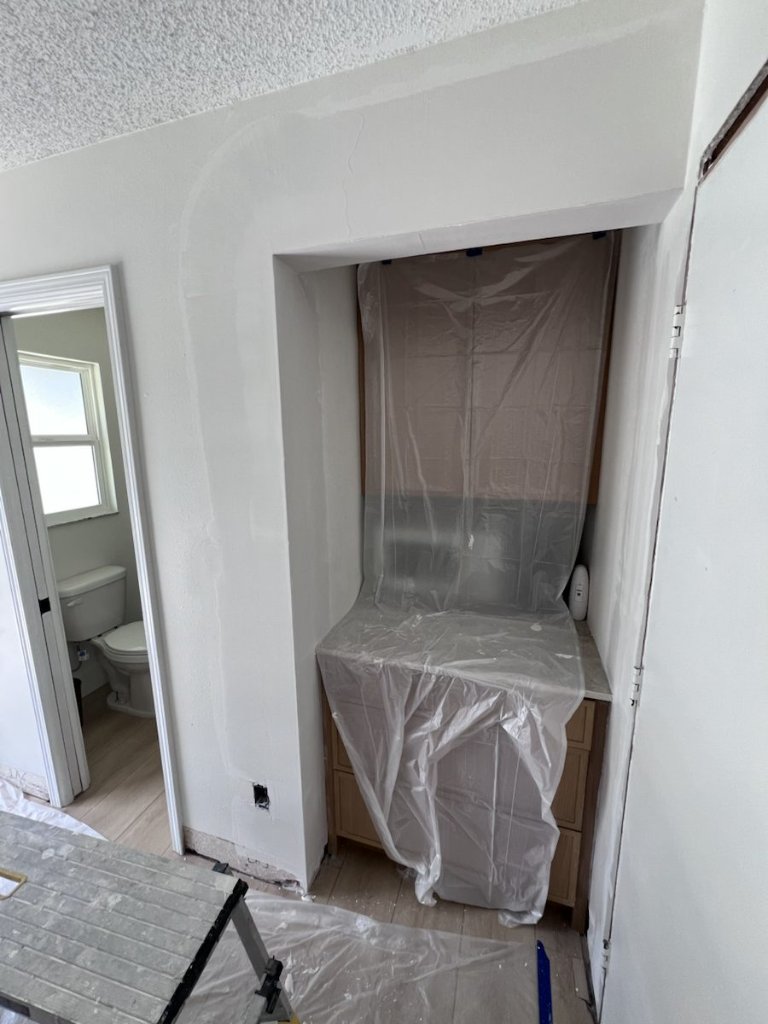 Drywall repair area opened and prepared for wall correction in Jacksonville, FL
