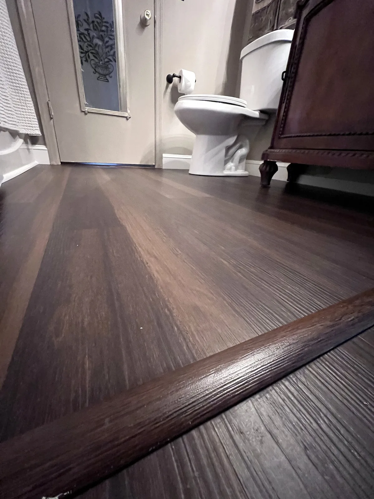 Completed LVP flooring and vanity installation