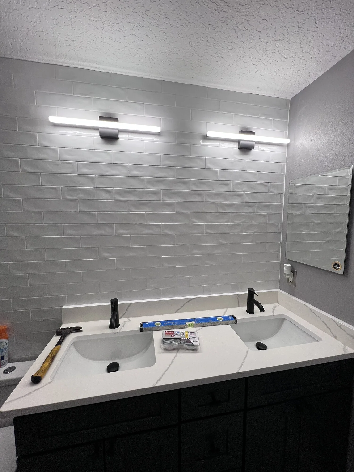 Double vanity wall before the mirrors were installed