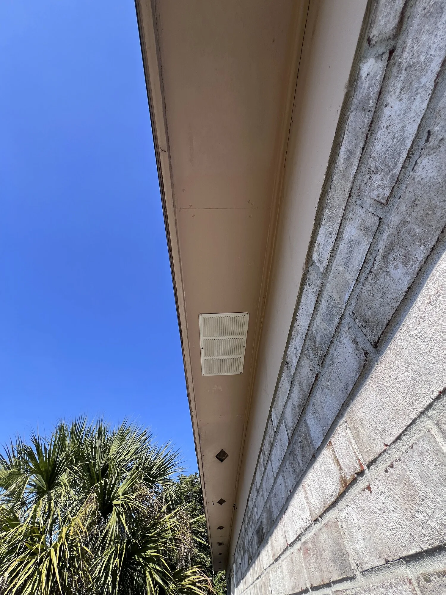 Finished vented soffit repair along a Jacksonville roofline