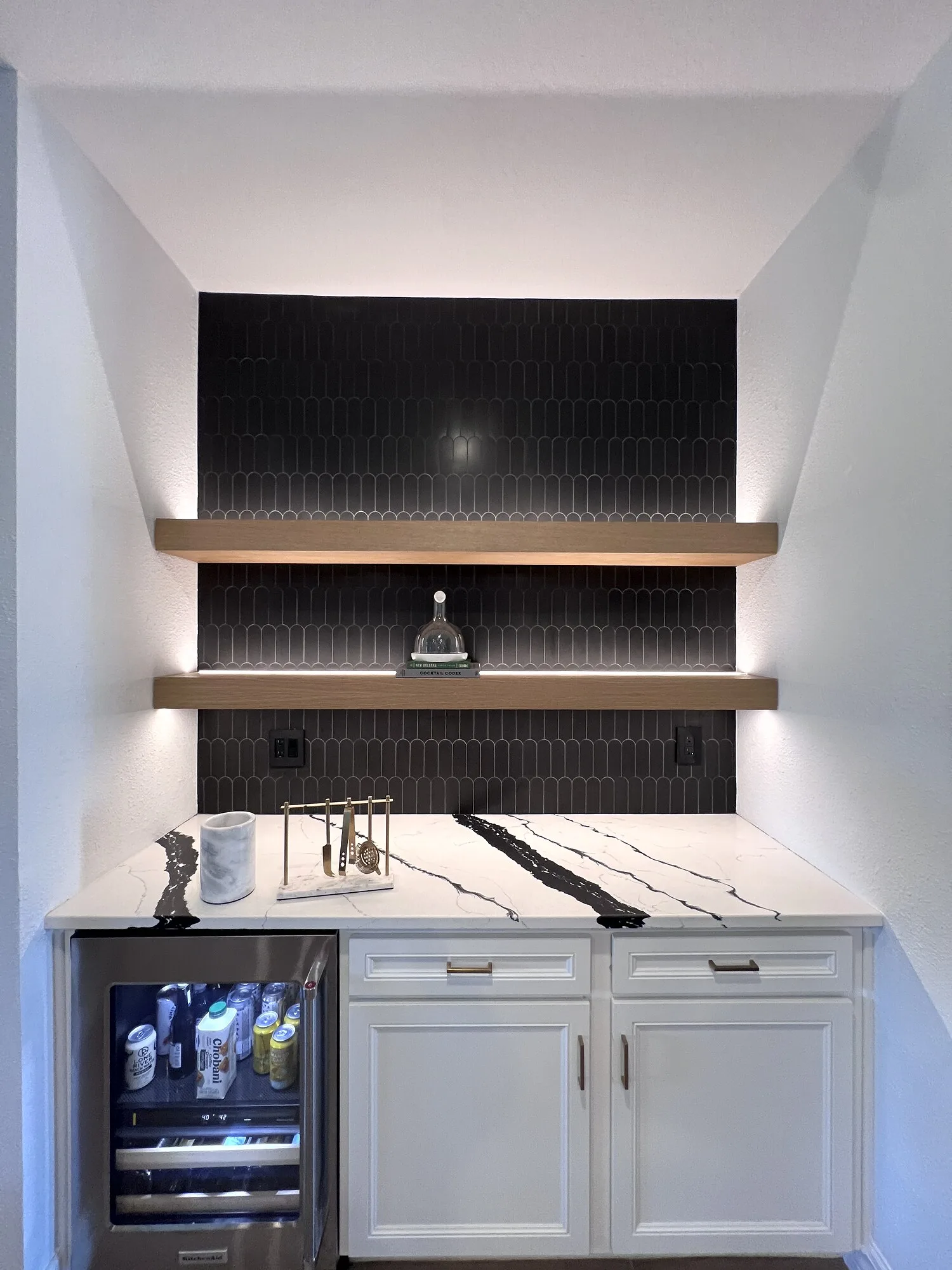 Reinforced floating shelves on a tiled feature wall in Ponte Vedra, Florida