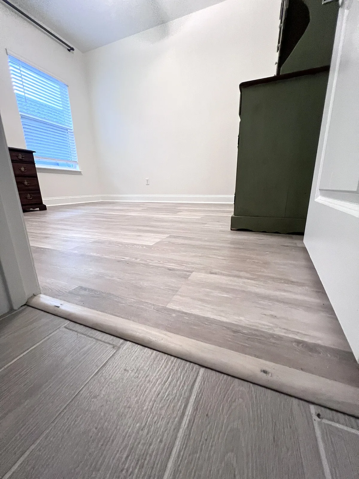 Finished LVP flooring across a bedroom in Yulee, Florida