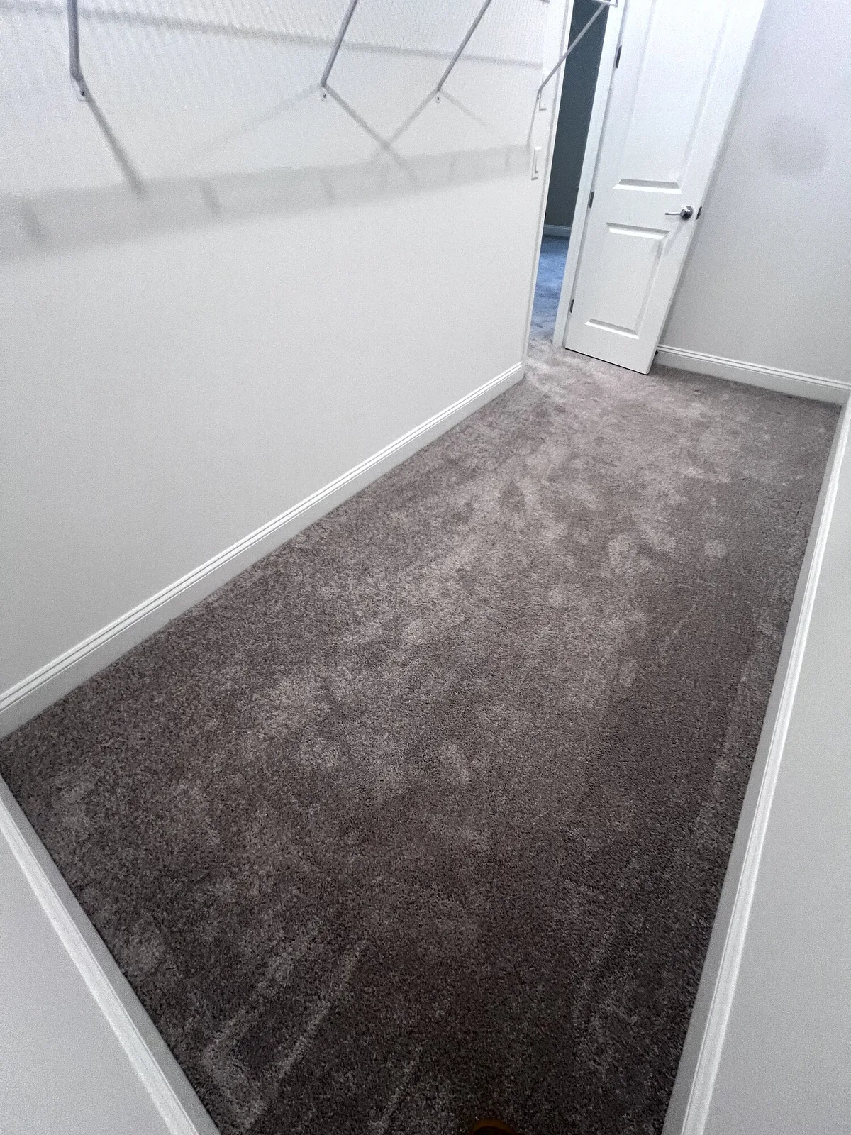 Bedroom closet with carpet before LVP installation