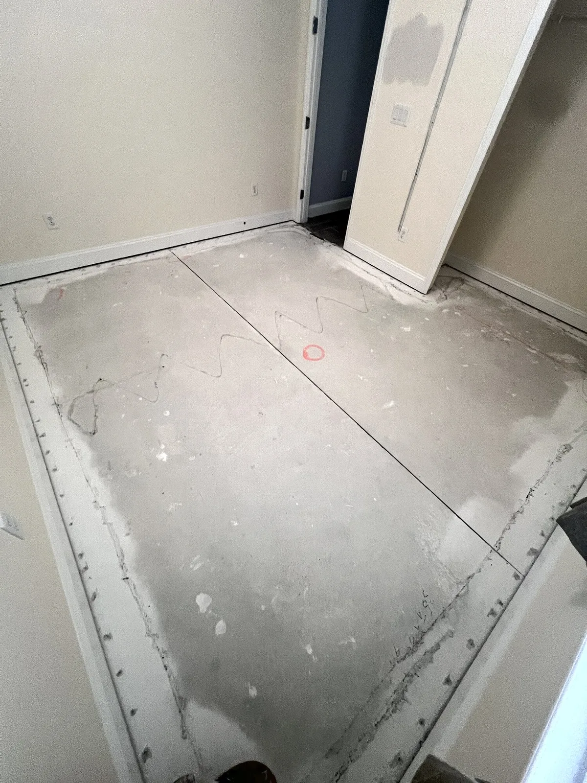 LVP flooring installation progressing across a bedroom
