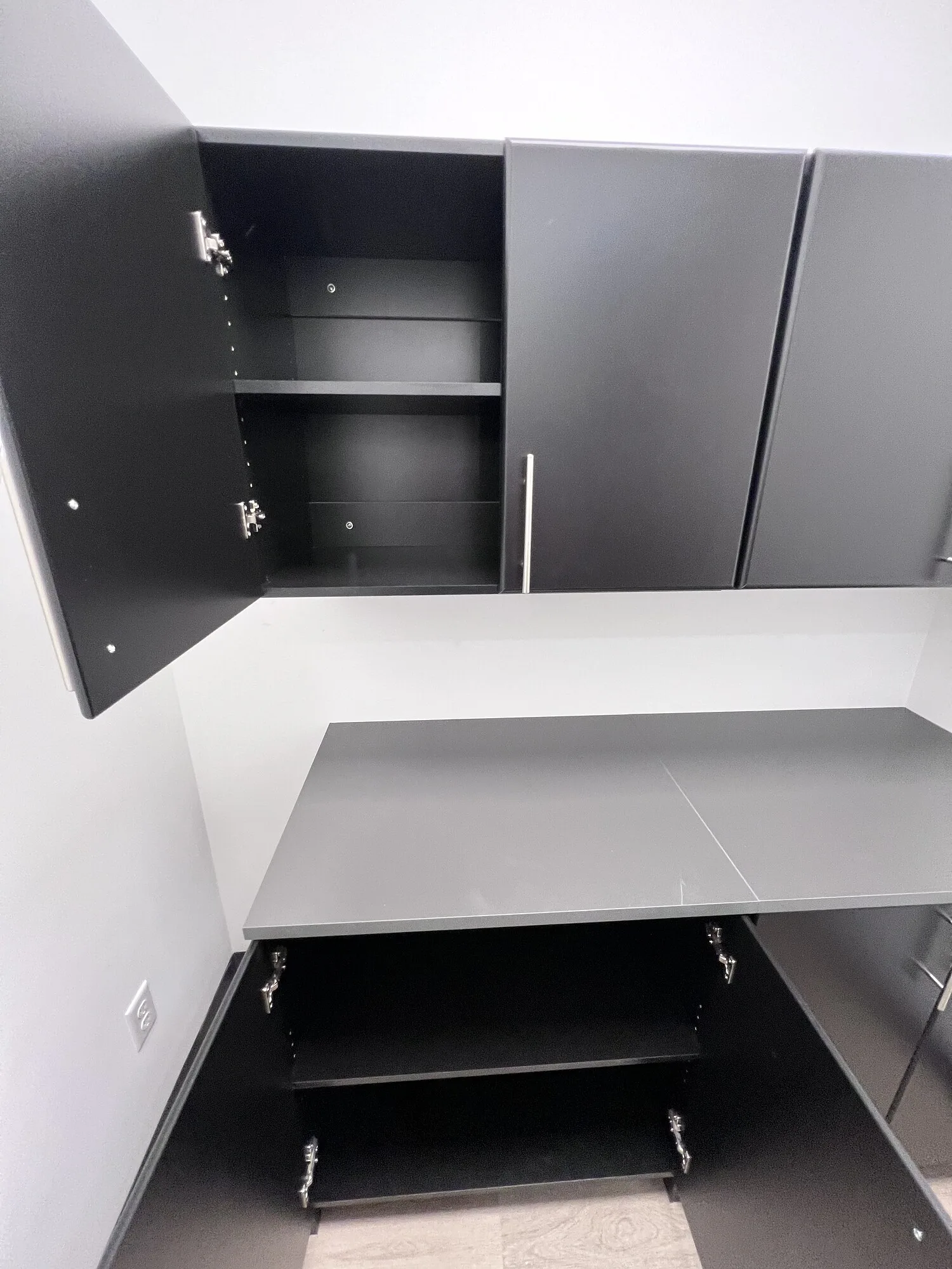 Open IKEA cabinets showing the installed shelves