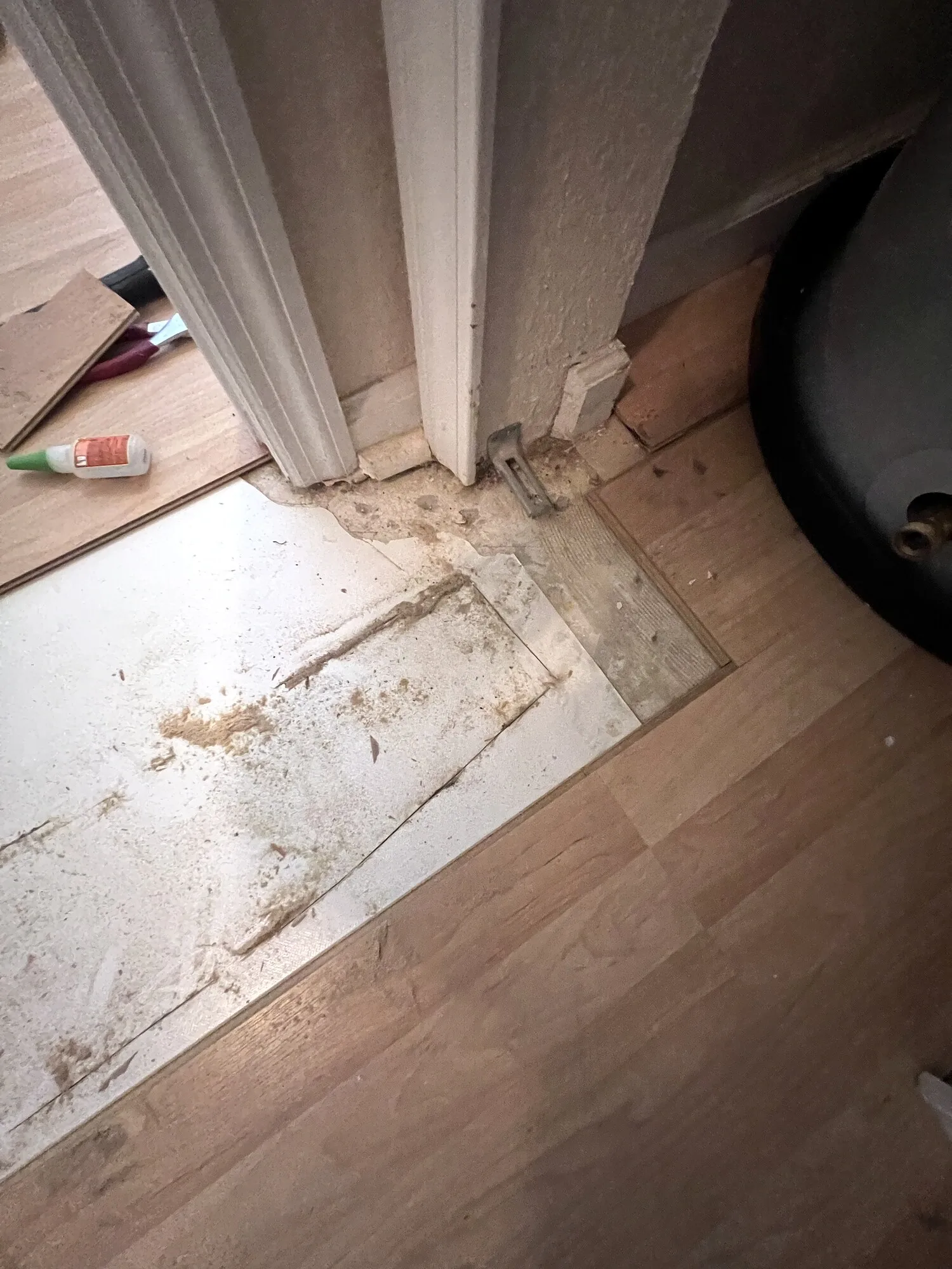 Second water-damaged area prepared for matching laminate planks