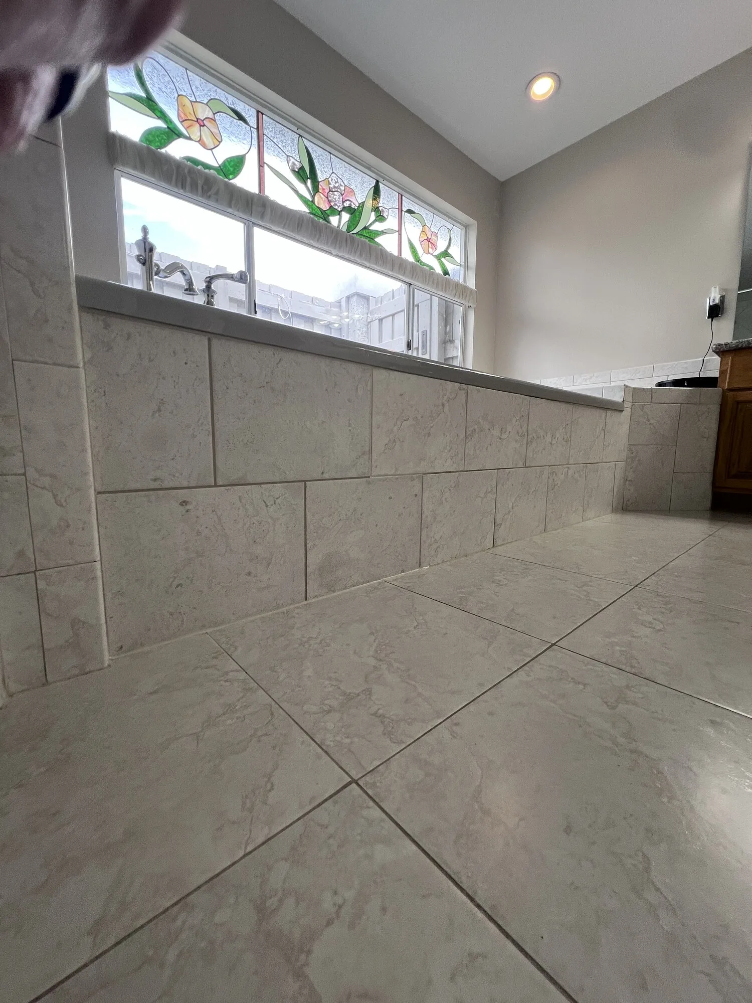 Finished removable tiled tub access panel in Jacksonville, Florida