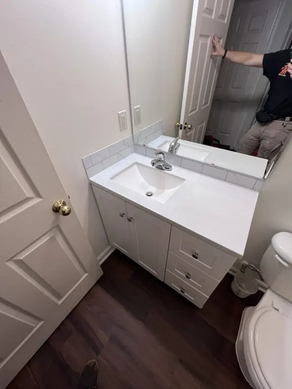 Bathroom vanity installation with plumbing fixture updates in Jacksonville, FL by Heylo Home
