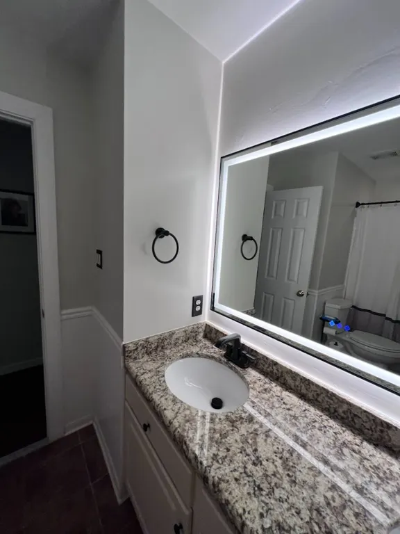 Backlit mirror and bathroom hardware installation in Jacksonville, FL by Heylo Home