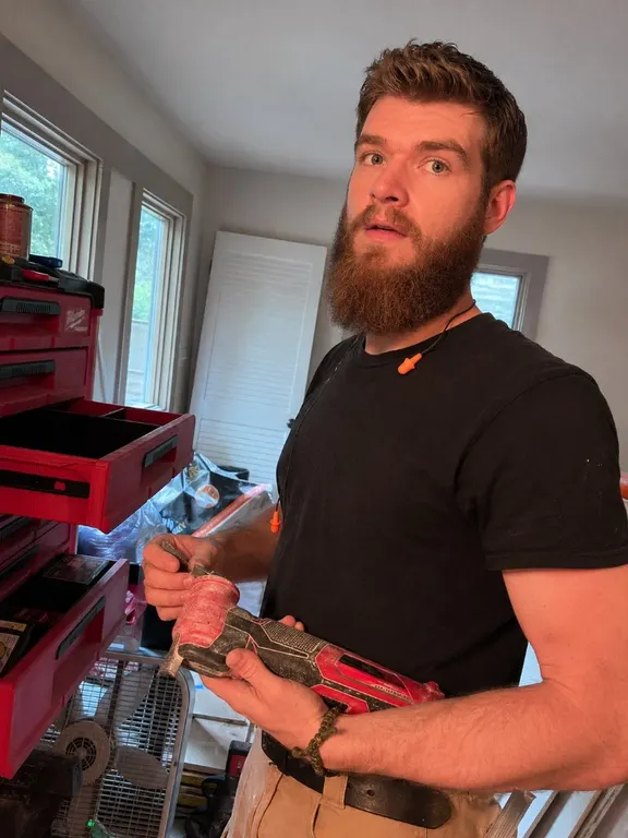 Montana from Heylo Home holding a power tool during a home project in Jacksonville, FL