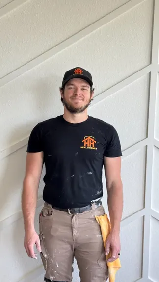 Montana from Heylo Home standing in work clothes in Jacksonville, FL