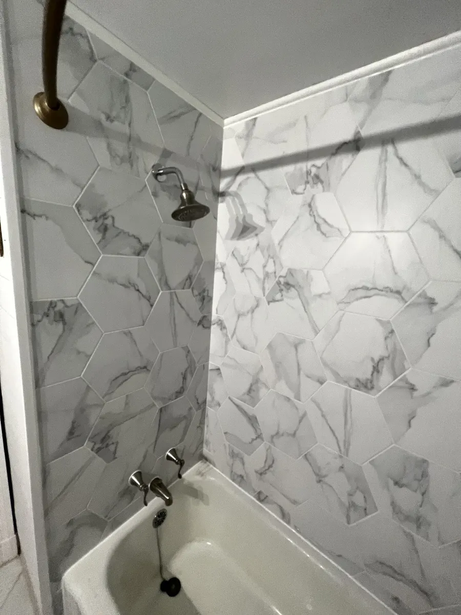 Completed marble-look tub surround