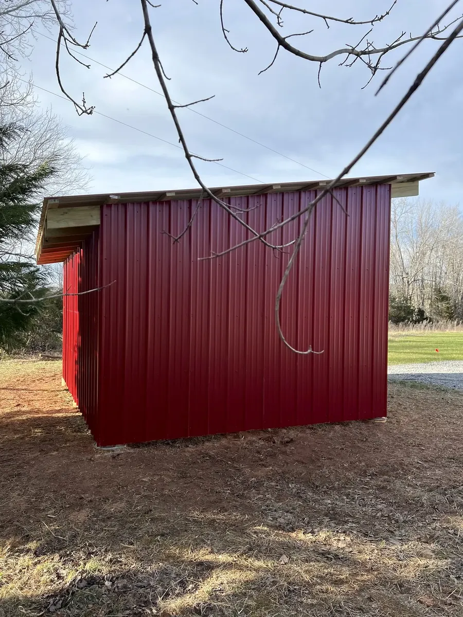 After photo 2 of the open-front storage shed