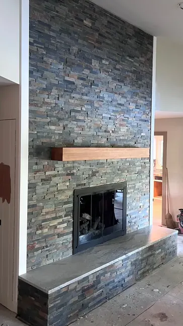 After photo 2 of the stone ledger fireplace