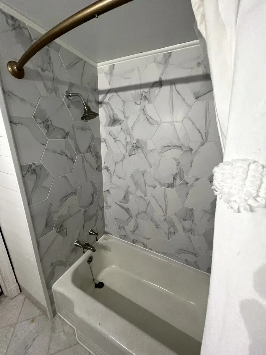 After photo 3 of the marble-look tub surround
