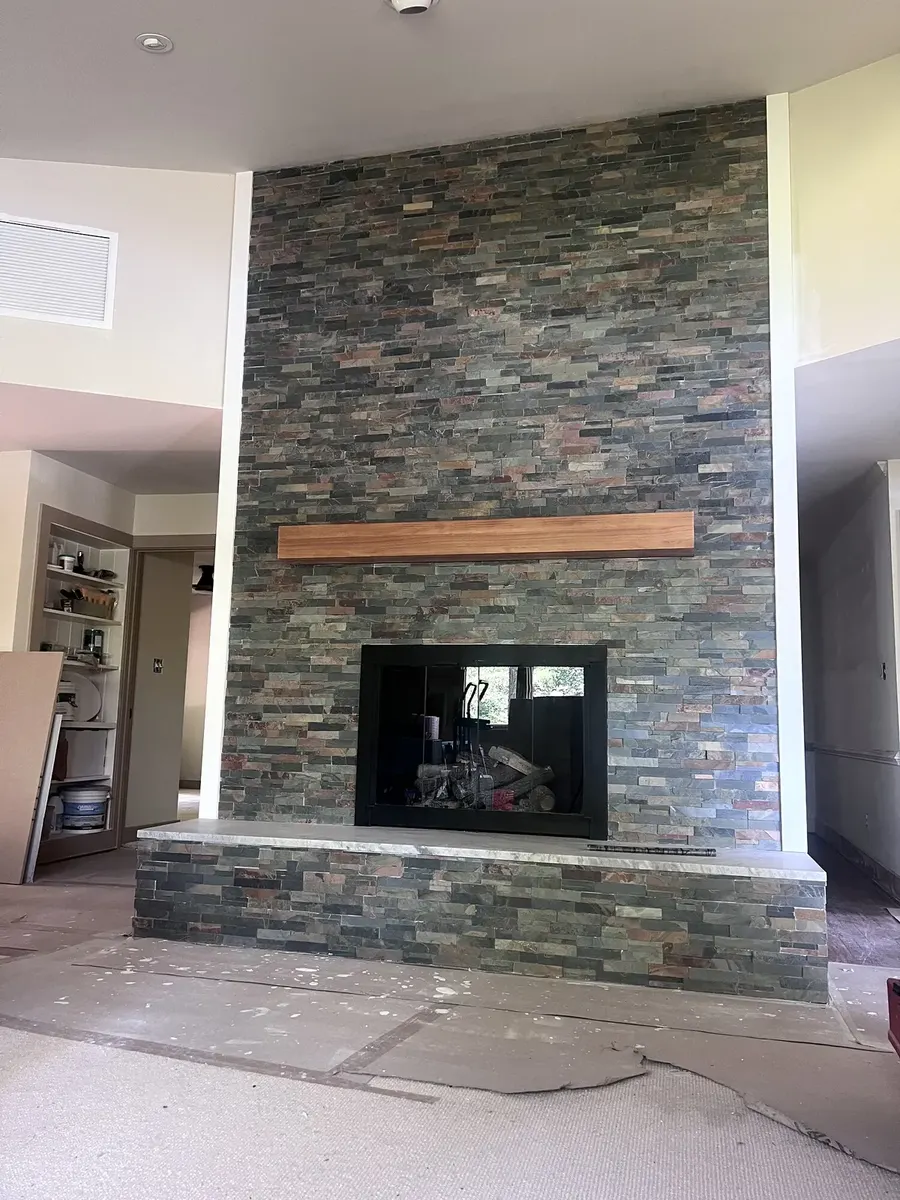 After photo 4 of the stone ledger fireplace
