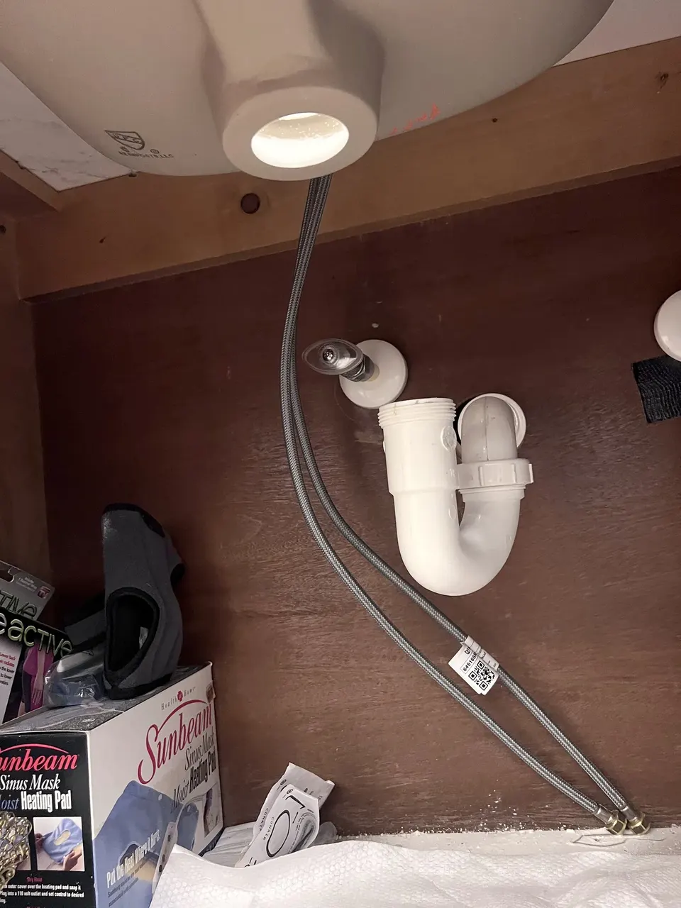 Existing bathroom sink drain connection before the update