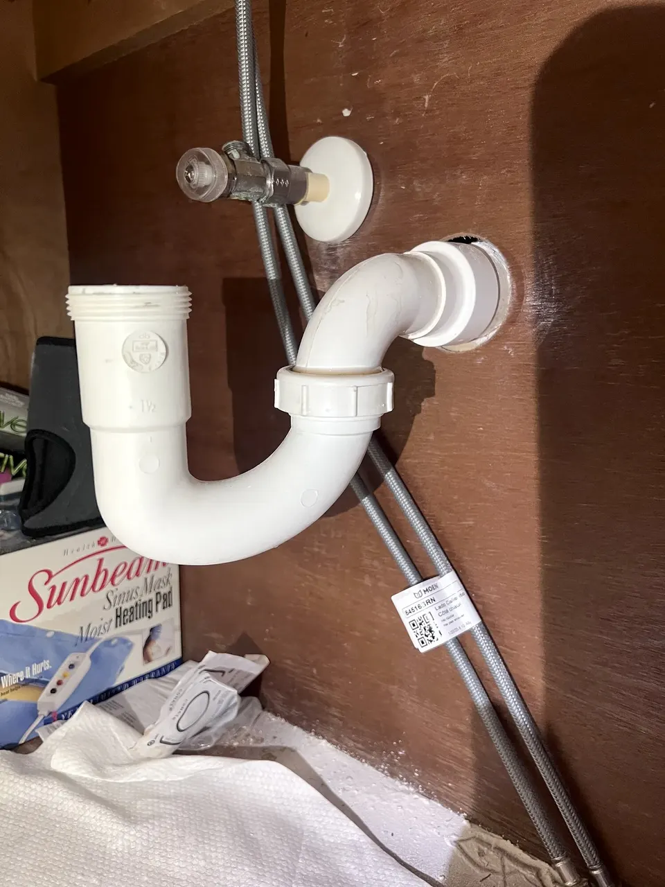 Close view of the original under-sink plumbing