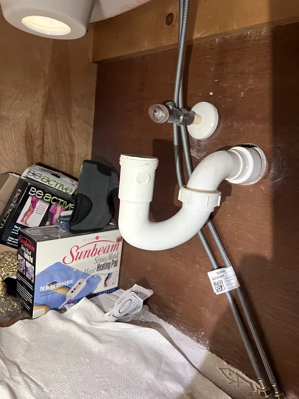 Original drain layout beneath the bathroom vanity