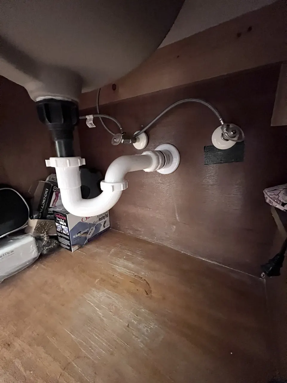 Completed P-trap and drain connection below the sink