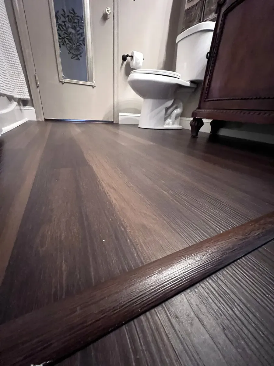 Completed LVP flooring and vanity installation
