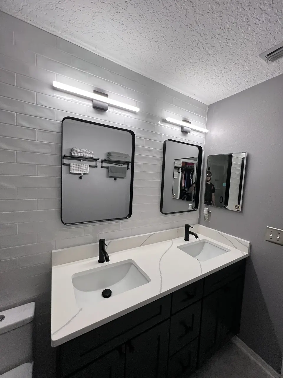 Finished pair of bathroom mirrors installed over a double vanity in Jacksonville, Florida