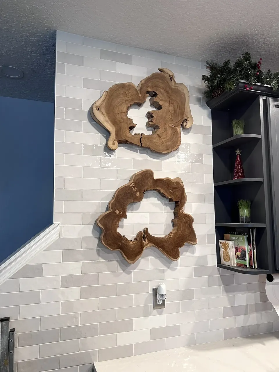 Decorative mirrors securely mounted on the tiled bathroom wall