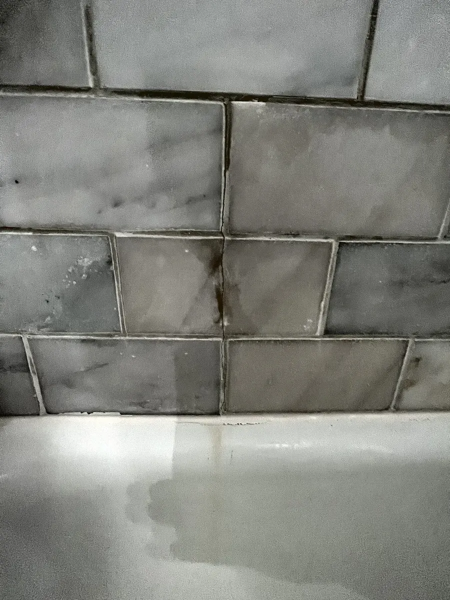 Before photo 3 of the marble-look tub surround