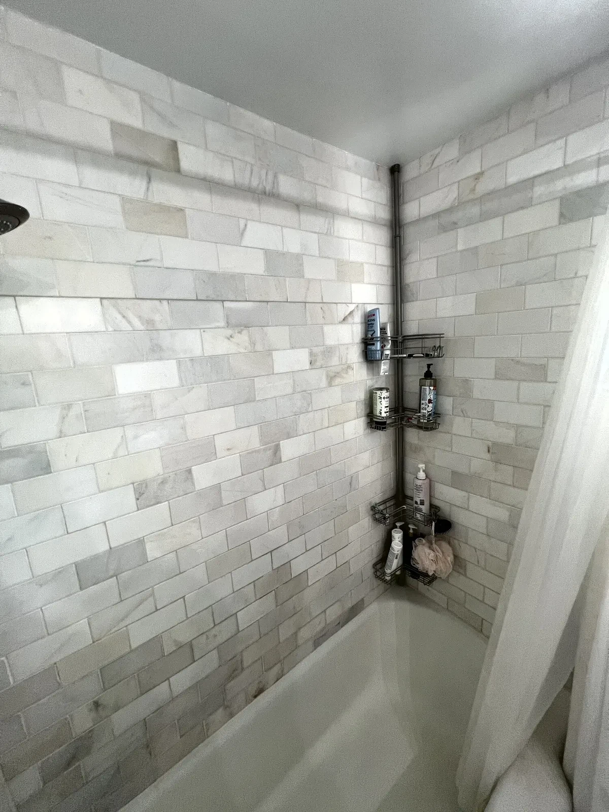 Before photo 4 of the marble-look tub surround