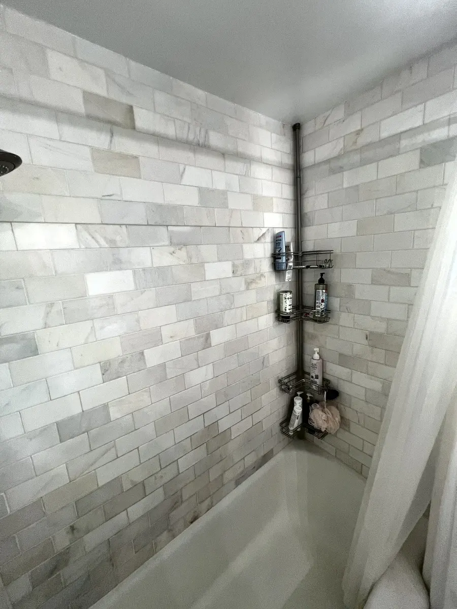 Before photo 4 of the marble-look tub surround