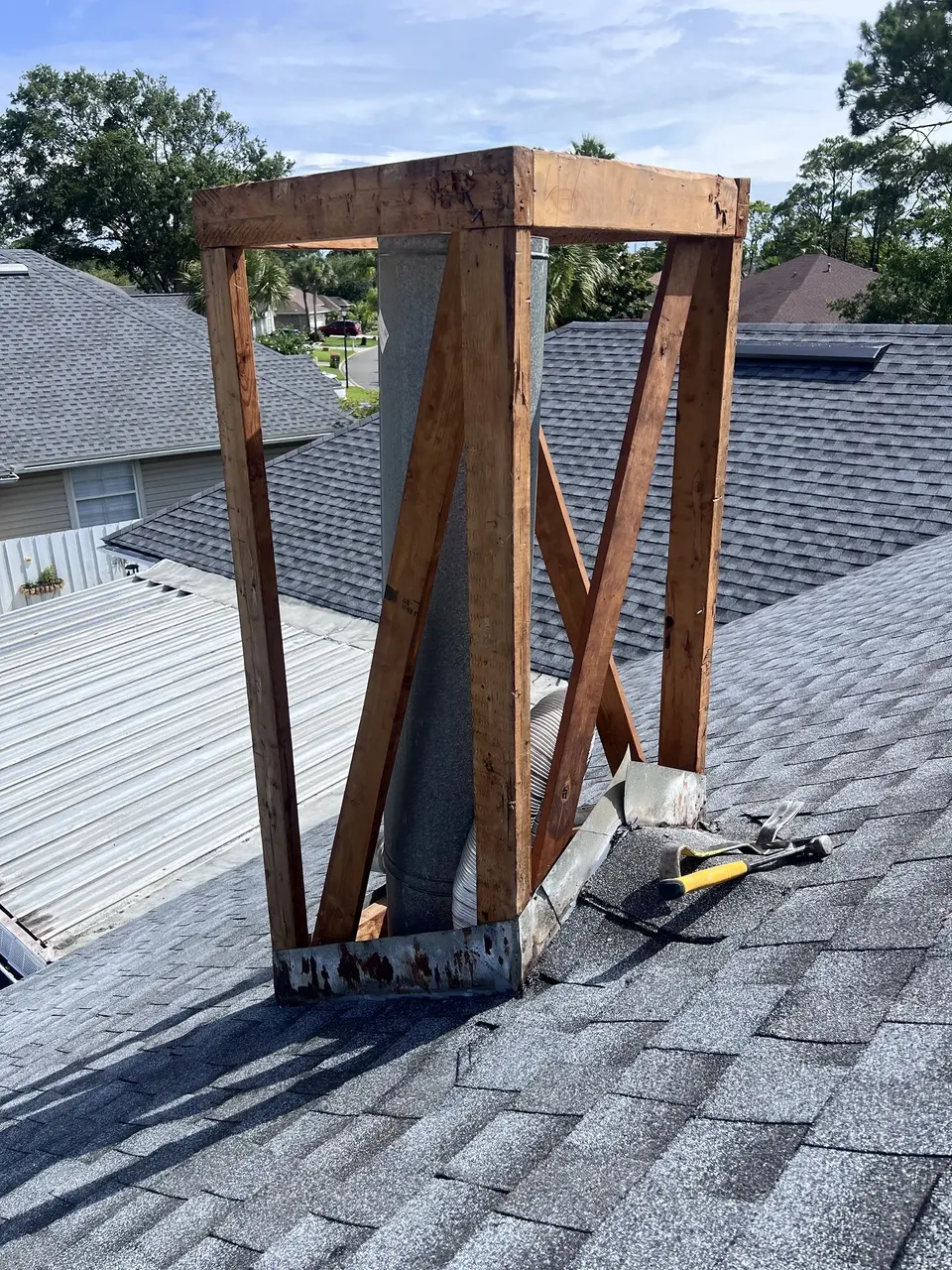 Chimney opened to expose the framing during repair