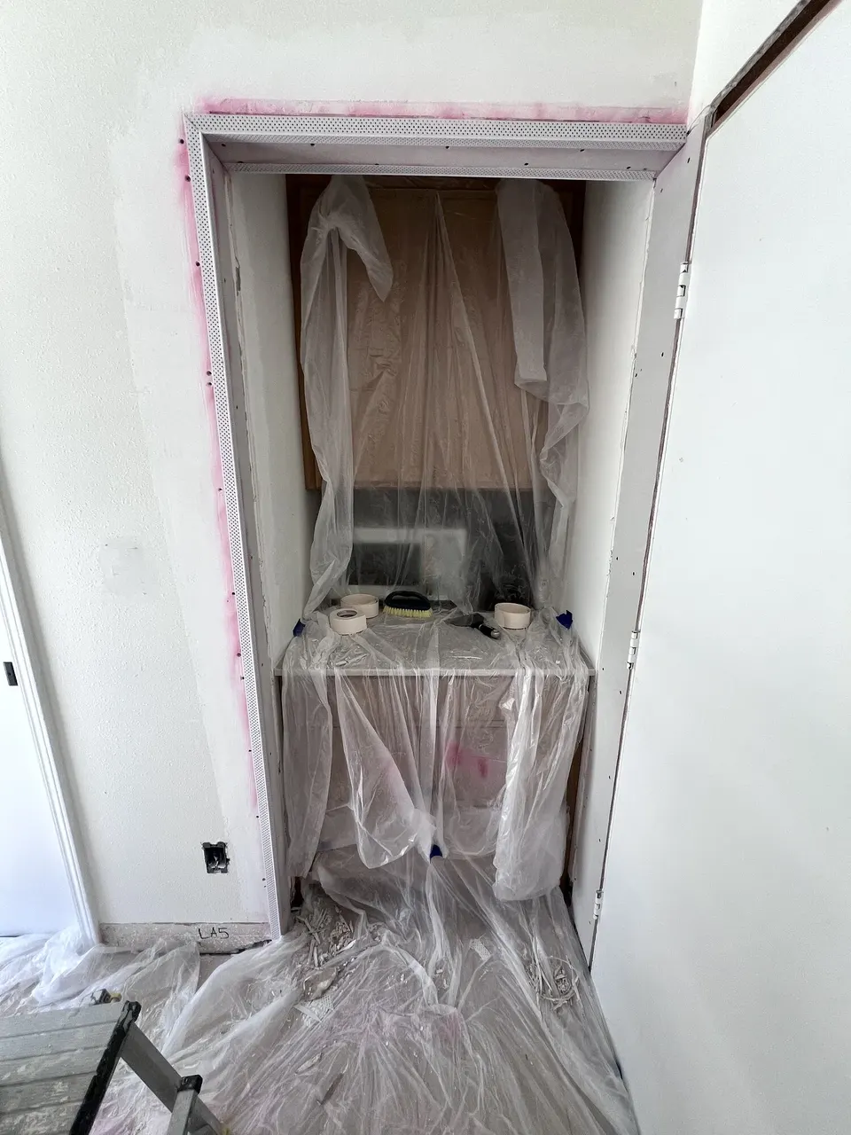 Coffee-bar wall opening prepared during the drywall repair