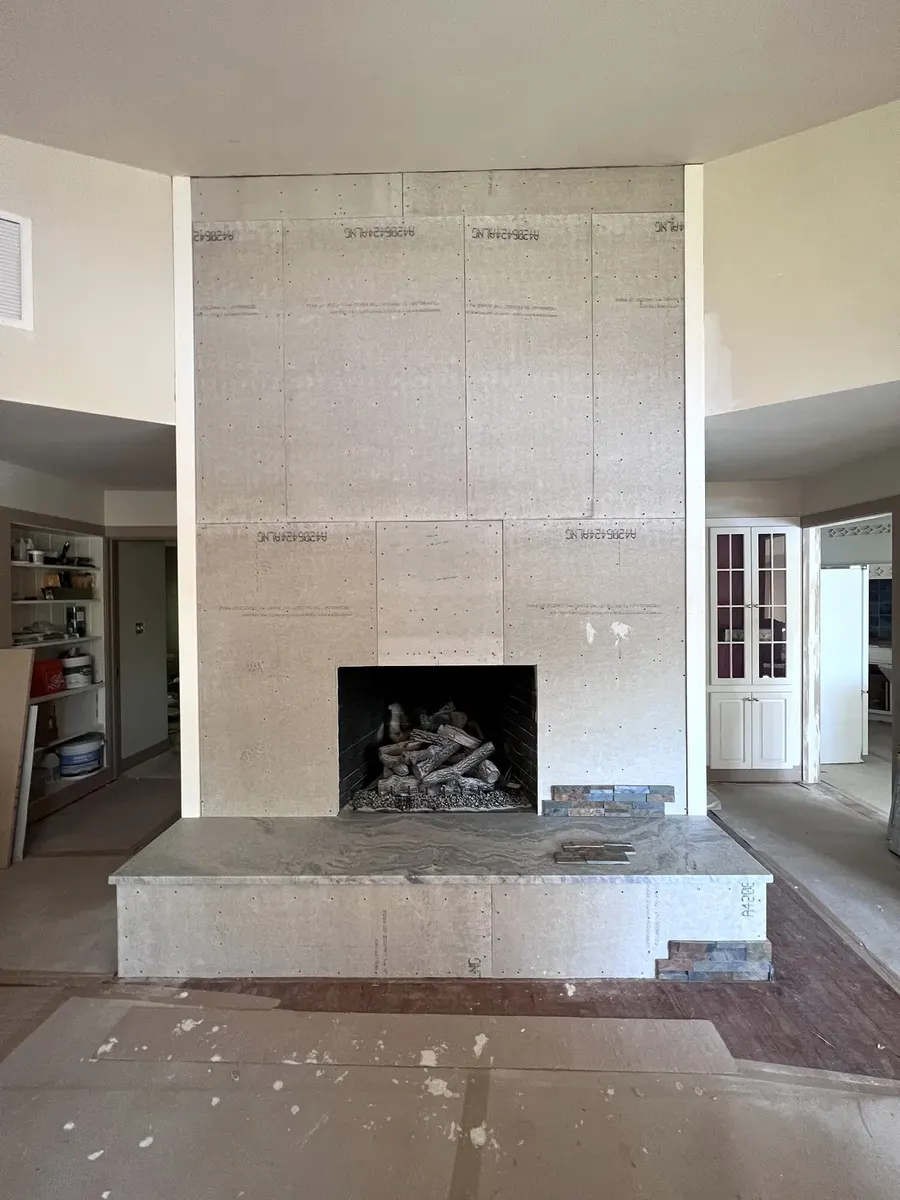 During photo 1 of the stone ledger fireplace
