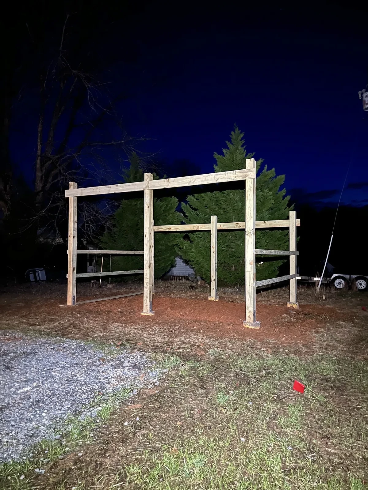 During photo 1 of the open-front storage shed