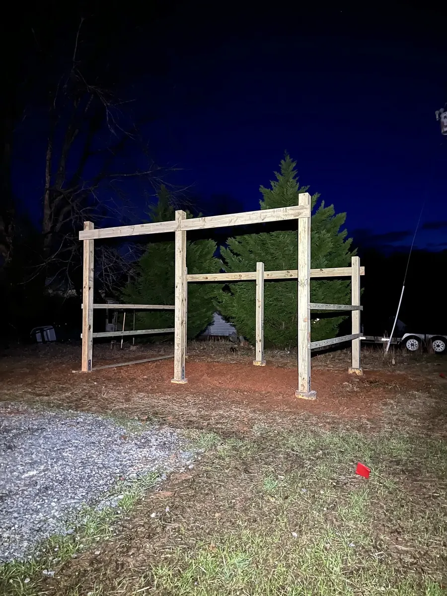 During photo 1 of the open-front storage shed