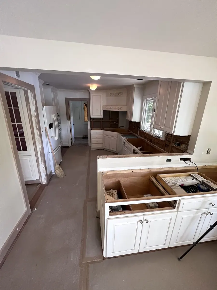 During photo 2 of the kitchen countertops & backsplash