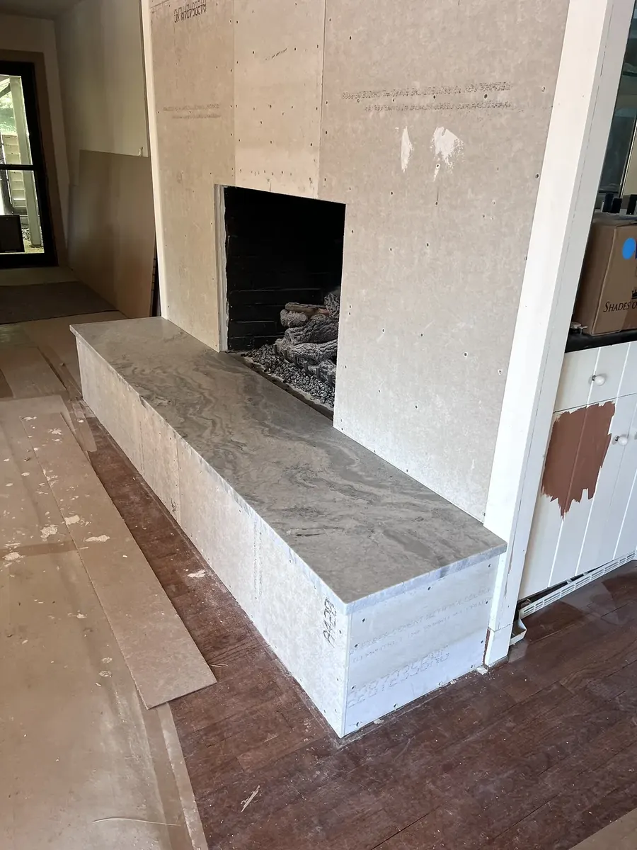 During photo 2 of the stone ledger fireplace