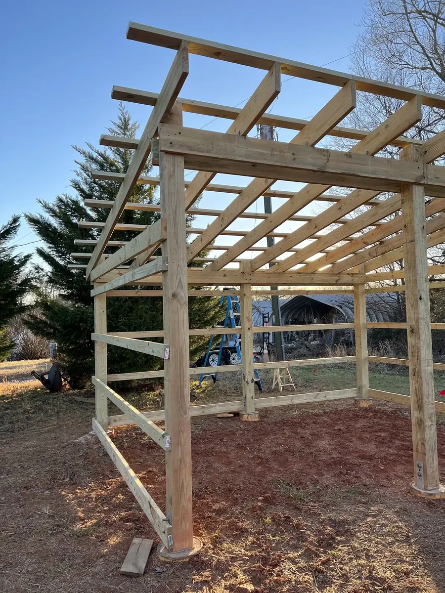 During photo 3 of the open-front storage shed