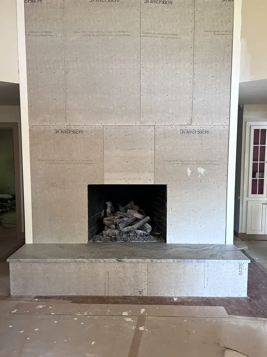 During photo 4 of the stone ledger fireplace