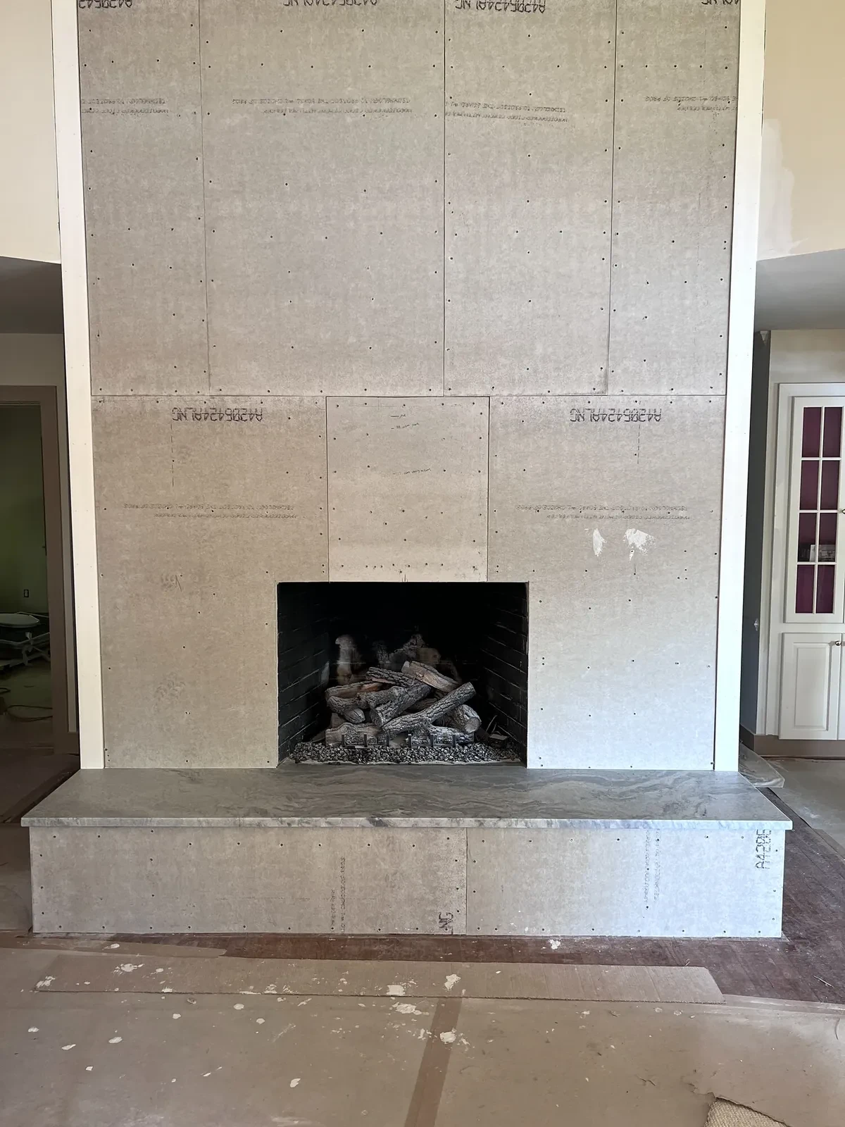 During photo 4 of the stone ledger fireplace