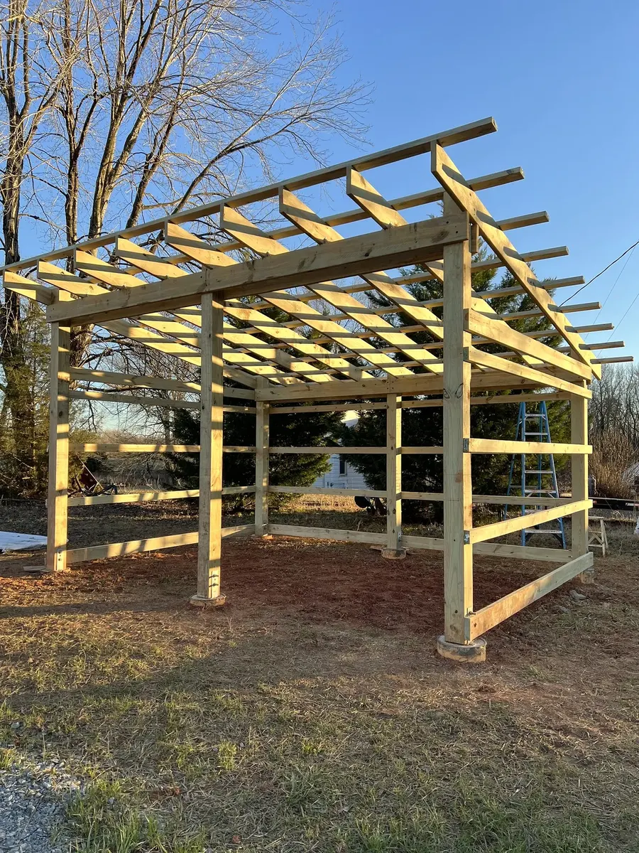 During photo 4 of the open-front storage shed