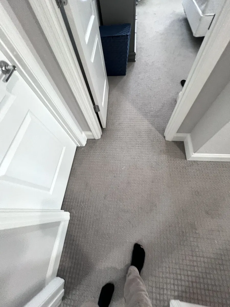 Upstairs hallway with carpet before the flooring update