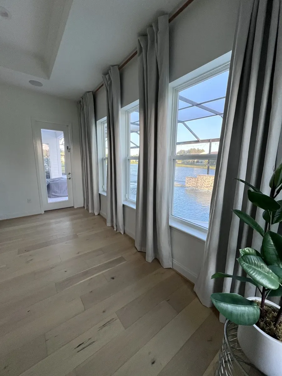 Finished engineered hardwood floor in a bright bedroom
