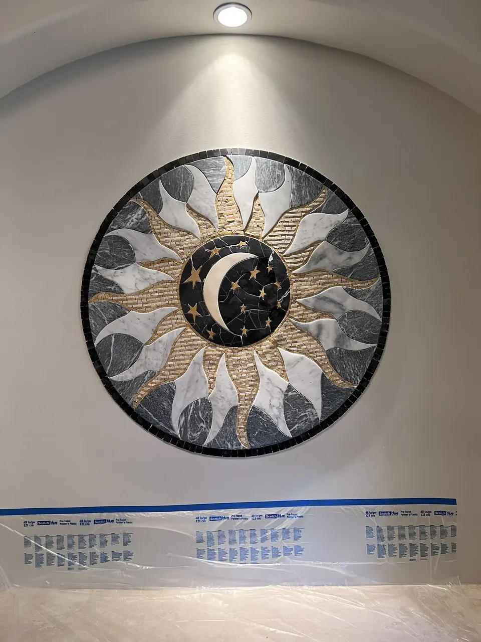 Second mosaic being set inside the wall niche