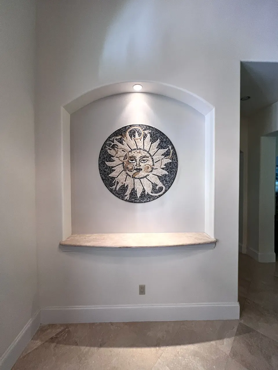 Decorative mosaic centered in the finished wall niche