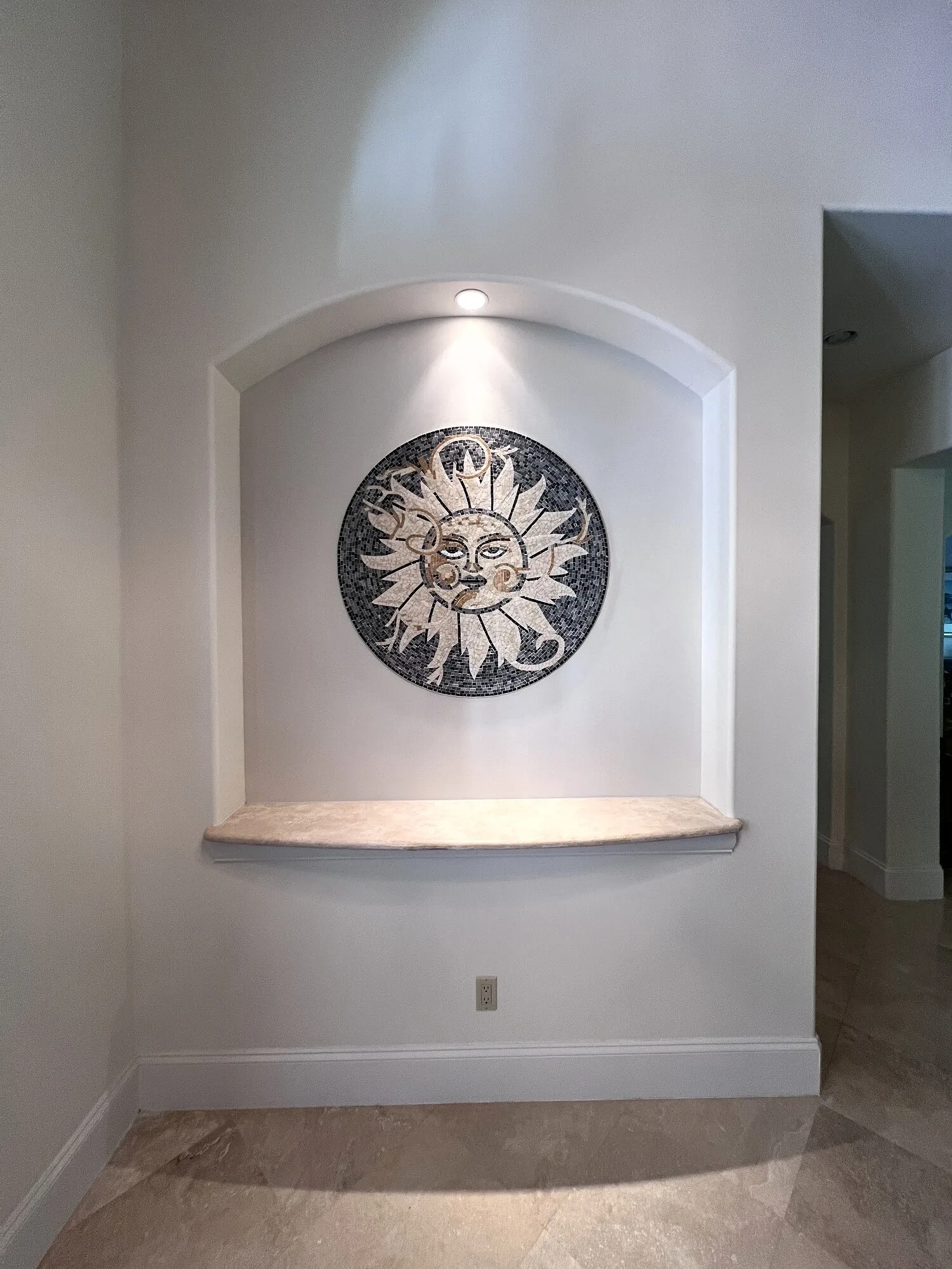 Decorative mosaic centered in the finished wall niche