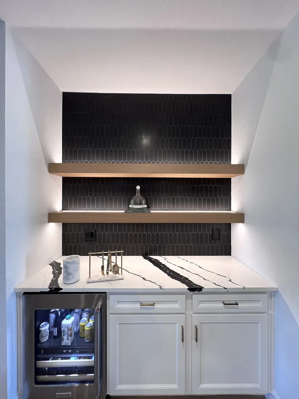 Reinforced floating shelves on a tiled feature wall in Ponte Vedra, Florida