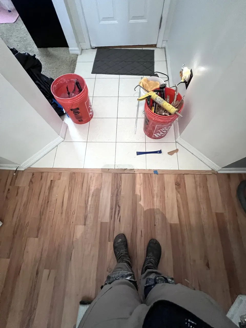 Exposed flooring edge at an entry before the transition was replaced