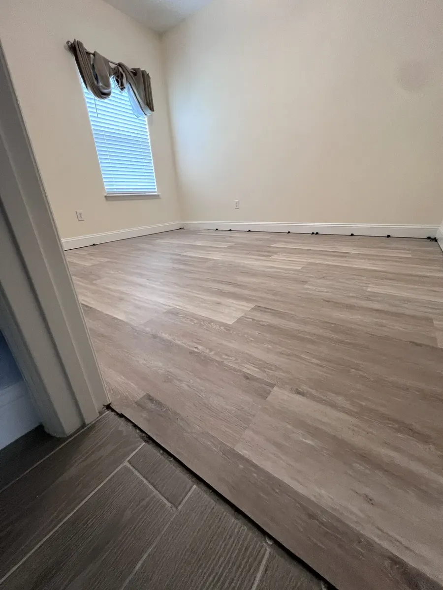 Finished LVP flooring with a clean doorway transition