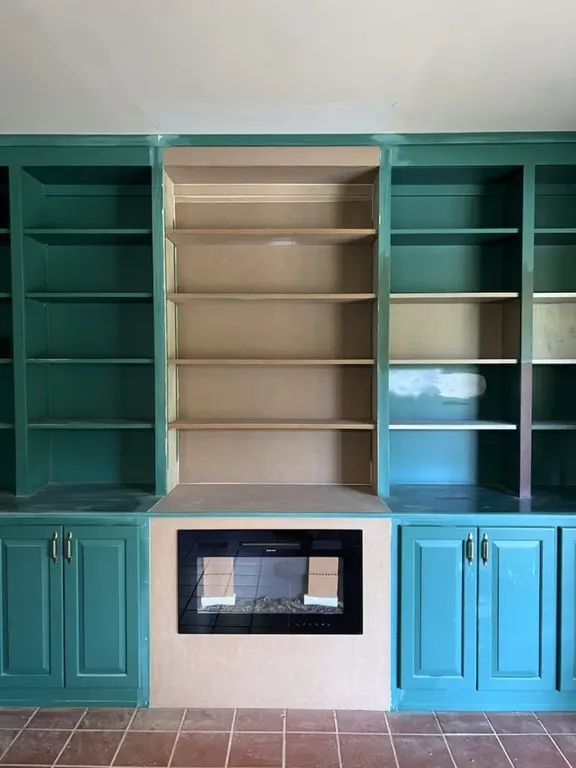 Built-in fireplace cabinets with finished storage and trim
